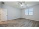Bright bedroom boasts a ceiling fan, window, and door at 7261 E Teal Way, San Tan Valley, AZ 85143