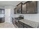 Modern kitchen with subway backsplash and stainless steel appliances at 7261 E Teal Way, San Tan Valley, AZ 85143
