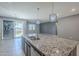 Gorgeous kitchen featuring large kitchen island with stainless steel sink and faucet at 7261 E Teal Way, San Tan Valley, AZ 85143