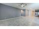 Open-concept living room with stainless steel appliances, tile flooring, granite countertops, and dark wood cabinetry at 7261 E Teal Way, San Tan Valley, AZ 85143