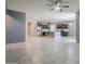 Open-concept living room with stainless steel appliances, tile flooring, granite countertops, and dark wood cabinetry at 7261 E Teal Way, San Tan Valley, AZ 85143