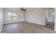 Bright living room features modern ceiling fan, wood floors and a view of front yard at 733 W El Prado Rd, Chandler, AZ 85225