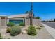 Landscaped Torrey Pines community entrance with manicured bushes, plants and desert landscaping at 8449 W Rockwood Dr, Peoria, AZ 85382