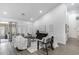 Open living area with neutral decor, vaulted ceilings, tile floors, and ample seating at 8449 W Rockwood Dr, Peoria, AZ 85382