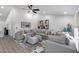 Spacious living room with high ceilings, stylish decor, comfortable seating, and natural light at 8449 W Rockwood Dr, Peoria, AZ 85382