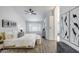 Spacious main bedroom with a ceiling fan, light-colored walls, and a walk-in closet at 8449 W Rockwood Dr, Peoria, AZ 85382