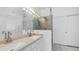 Contemporary bathroom with a double sink vanity, framed mirrors, and a walk-in shower at 853 W Hemlock Way, Chandler, AZ 85248