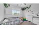 Bright bedroom with dinosaur-themed bedding, natural light, and fun jungle decorations at 853 W Hemlock Way, Chandler, AZ 85248