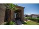A covered front entry with decorative door and desert landscaping at 853 W Hemlock Way, Chandler, AZ 85248