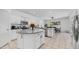 Spacious kitchen with white cabinets, granite countertops, stainless steel appliances, and an island at 853 W Hemlock Way, Chandler, AZ 85248