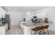 Bright and open kitchen featuring white cabinets, granite countertops, a large island, and stainless appliances at 853 W Hemlock Way, Chandler, AZ 85248