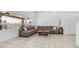 Bright and spacious living room with a large sectional sofa and views of the outdoor space at 853 W Hemlock Way, Chandler, AZ 85248