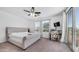 Light-filled main bedroom with a plush bed, balcony access, and windows overlooking the neighborhood at 853 W Hemlock Way, Chandler, AZ 85248