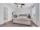 Comfortable main bedroom featuring a tufted headboard, neutral decor, and plenty of natural light at 853 W Hemlock Way, Chandler, AZ 85248