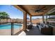 Outdoor patio with a pool view, cozy seating, ceiling fan, and string lights at 853 W Hemlock Way, Chandler, AZ 85248