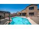 A sparkling pool with a relaxing lounge area and views of the two-story home at 853 W Hemlock Way, Chandler, AZ 85248