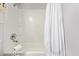 Bathroom shower featuring a large shower head and built-in shelves at 8538 E Portland St, Scottsdale, AZ 85257