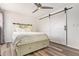 Bright bedroom featuring ceiling fan and a large barn door closet providing ample storage space at 8538 E Portland St, Scottsdale, AZ 85257