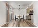 Cozy dining area adjacent to the kitchen with wood flooring and a sliding glass door at 8538 E Portland St, Scottsdale, AZ 85257