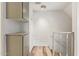 Bright hallway features storage cabinets, white brick wall and wood look floors at 8538 E Portland St, Scottsdale, AZ 85257