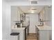 Modern kitchen featuring stainless steel appliances, white cabinets, and subway tile backsplash at 8538 E Portland St, Scottsdale, AZ 85257