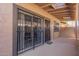 Inviting patio with covered area features steel security doors at 8538 E Portland St, Scottsdale, AZ 85257