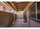 Comfortable patio features covered area, brick floor and gated entrances at 8538 E Portland St, Scottsdale, AZ 85257