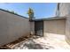 Backyard with a door to the home and an exterior storage area at 8552 E Indian School Rd # B, Scottsdale, AZ 85251