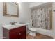 Bathroom includes decorative shower curtain, mirror, vanity, and flooring at 8552 E Indian School Rd # B, Scottsdale, AZ 85251
