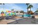 Sparkling community pool with lounge chairs and palm trees at 8552 E Indian School Rd # B, Scottsdale, AZ 85251
