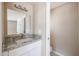 Bathroom featuring granite countertop, mirror, updated sink and faucet, and toilet at 8600 E Broadway Rd # 53, Mesa, AZ 85208