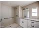 Modern bathroom with neutral tile, updated vanity, and accessible shower features at 8600 E Broadway Rd # 53, Mesa, AZ 85208