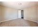 Bright carpeted bedroom with neutral walls features a ceiling light and natural light at 8600 E Broadway Rd # 53, Mesa, AZ 85208