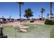 Community golf putting green offers a fun recreational space with lush landscaping and scenic views at 8600 E Broadway Rd # 53, Mesa, AZ 85208