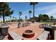 Community area with BBQ, fire pit, seating, and beautiful landscaping, perfect for socializing outdoors at 8600 E Broadway Rd # 53, Mesa, AZ 85208