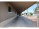 Spacious, covered patio area with a smooth concrete floor, perfect for parking or outdoor activities at 8600 E Broadway Rd # 53, Mesa, AZ 85208