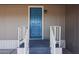 Exterior of home with stairway to front door with classic lamp at 8600 E Broadway Rd # 53, Mesa, AZ 85208