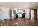 Well-lit kitchen showcases white cabinets, stainless steel appliances, and dark countertops on a wood-look floor at 8600 E Broadway Rd # 53, Mesa, AZ 85208