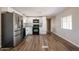 Modern kitchen offers a bright space with stainless appliances, black accents, and wood-look floors at 8600 E Broadway Rd # 53, Mesa, AZ 85208
