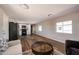Spacious living room with wood-look floors open to the kitchen, maximizing space and functionality at 8600 E Broadway Rd # 53, Mesa, AZ 85208