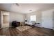 Inviting living room shows neutral paint, modern furniture, and wood-look floors with an open floor plan at 8600 E Broadway Rd # 53, Mesa, AZ 85208