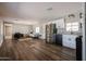 Open-concept living space shows the kitchen, living room, and an abundance of natural light at 8600 E Broadway Rd # 53, Mesa, AZ 85208