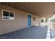 Spacious covered porch leading to the home's entrance, offering outdoor living space and curb appeal at 8600 E Broadway Rd # 53, Mesa, AZ 85208