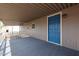 Inviting covered porch with blue door providing sheltered outdoor space and access to the home at 8600 E Broadway Rd # 53, Mesa, AZ 85208