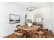 Cozy dining area with a round wooden table, stylish chairs, and modern lighting at 917 W Willetta St, Phoenix, AZ 85007