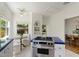 Bright and airy kitchen features stainless steel appliances, gas range, and an adjacent breakfast nook with garden views at 917 W Willetta St, Phoenix, AZ 85007