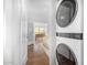 Convenient laundry area adjacent to the main bedroom, featuring a stacked washer and dryer at 917 W Willetta St, Phoenix, AZ 85007