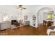 Bright living room featuring hardwood floors, a fireplace, and neutral-colored furnishings at 917 W Willetta St, Phoenix, AZ 85007