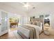 Spacious main bedroom with hardwood floors, neutral decor, and french doors leading to a separate sitting area at 917 W Willetta St, Phoenix, AZ 85007
