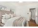 Bright and airy main bedroom with hardwood floors, neutral decor, and ample natural light at 917 W Willetta St, Phoenix, AZ 85007